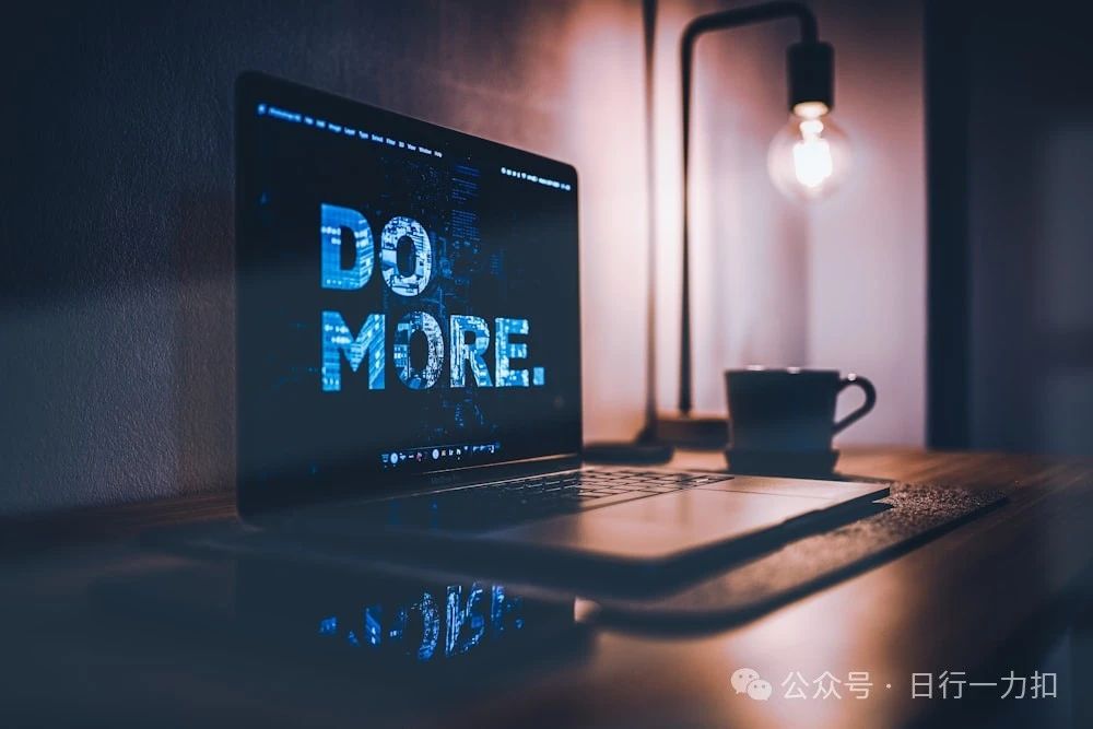 black laptop computer beside black ceramic mug