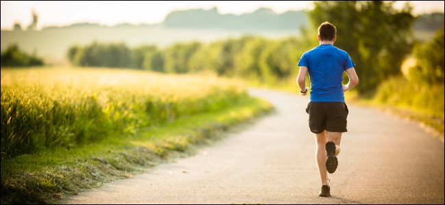 A jogger running on a road.