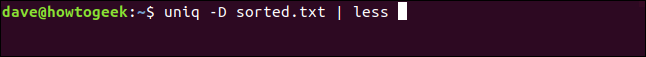 The "uniq -D sorted.txt | less" command in a terminal window.