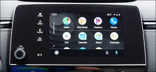 A touch screen in a vehicle displaying a phone's apps via Android Auto.