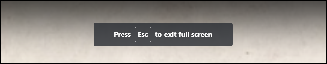 The "Press Esc to exit full screen" message while watching a full-screen video in YouTube.