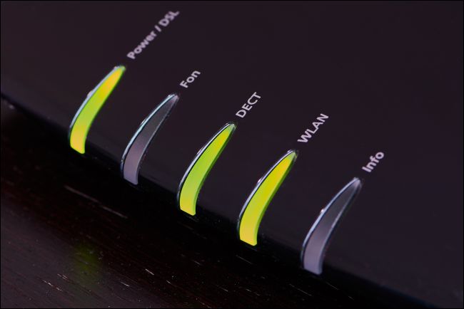 Green status lights on a modem.