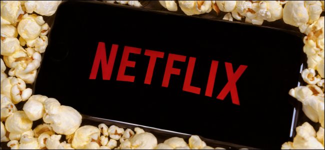 netflix on phone with popcorn