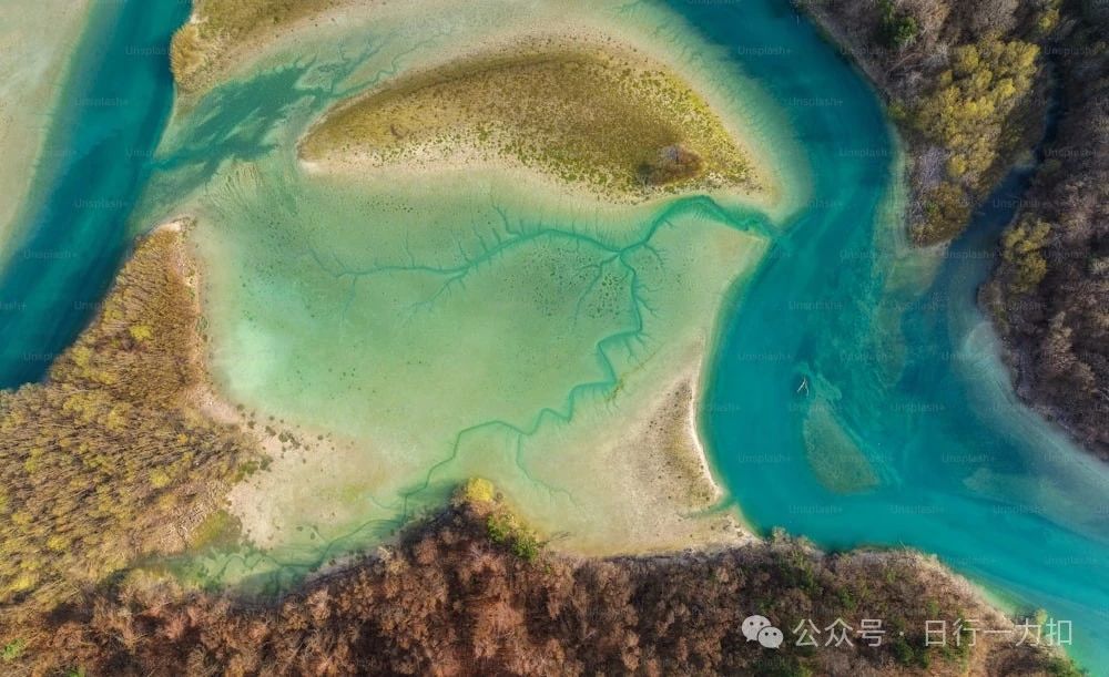 an aerial view of a body of water surrounded by land