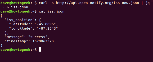 The "curl -s http://api.open-notify.org/iss-now.json | jq . > iss.json" and "cat iss.json" commands in a terminal window.