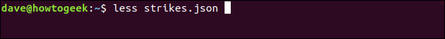 The "less strikes.json" command in less in a terminal window.