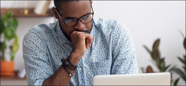 A man stares at his laptop, wondering how to use TFW.