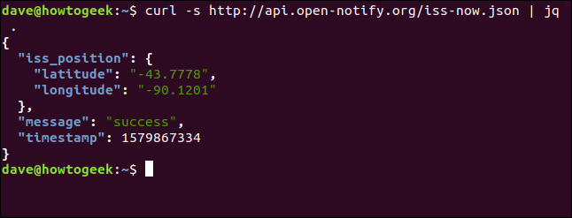 The "curl -s http://api.open-notify.org/iss-now.json | jq ." command in a terminal window. 