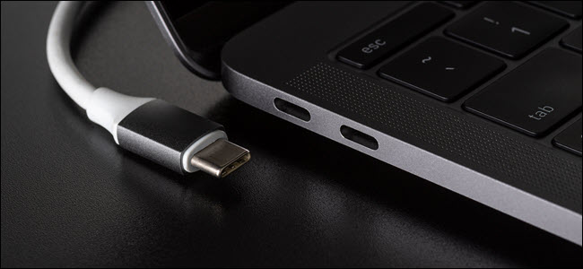 USB-C cable next to USB-C Compatible laptop