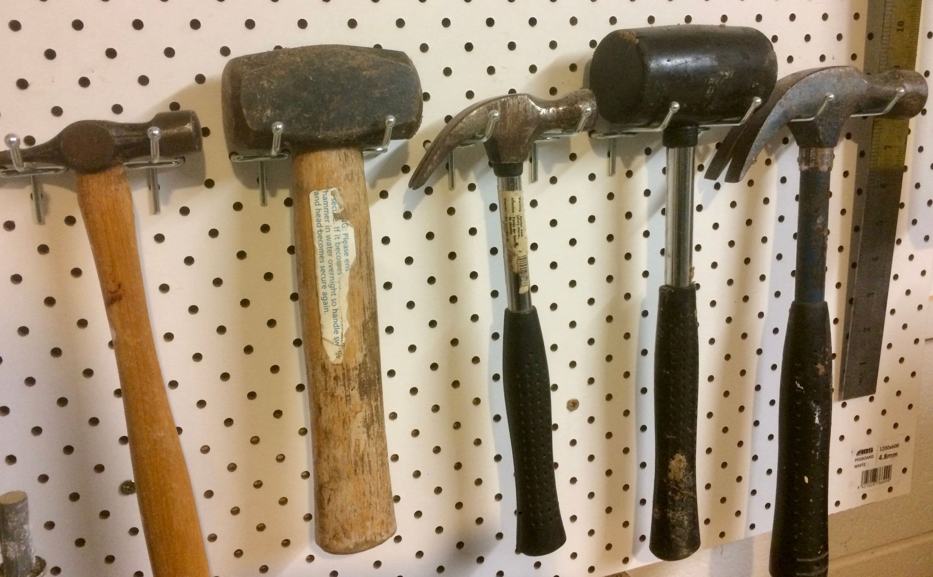 Five hammers hanging on the wall