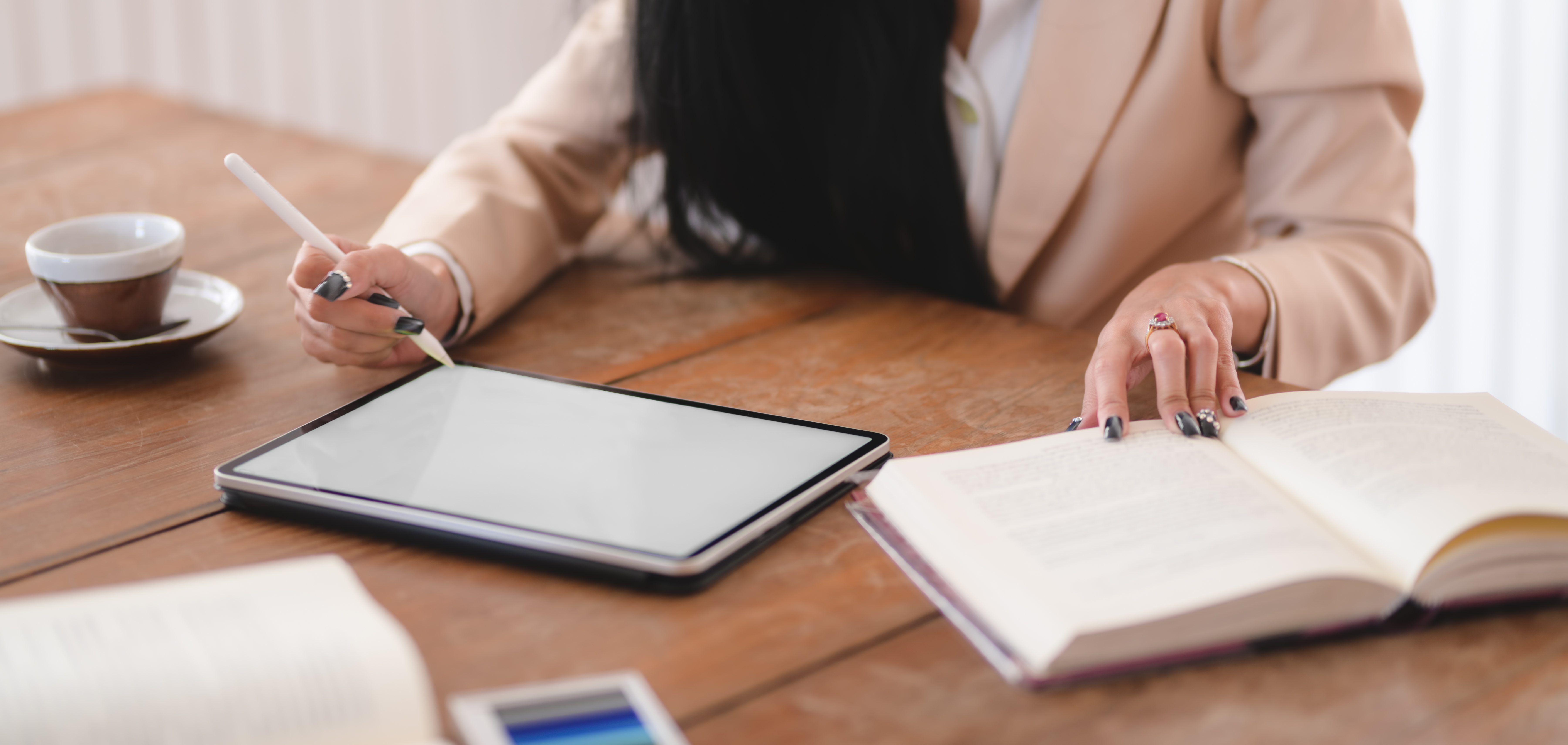 photo-of-woman-using-tablet-while-holding-book-3803224.jpg