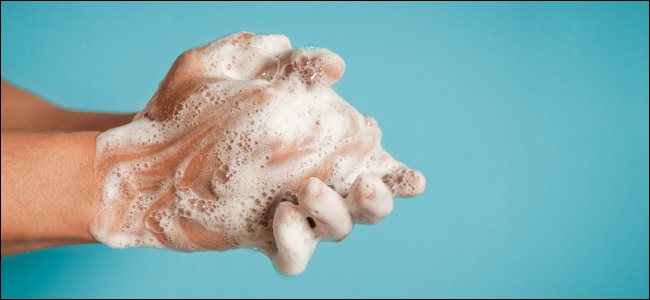 A person washing their hands.