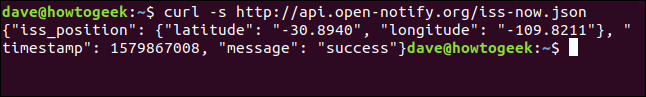 The "curl -s http://api.open-notify.org/iss-now.json" command in a terminal window.